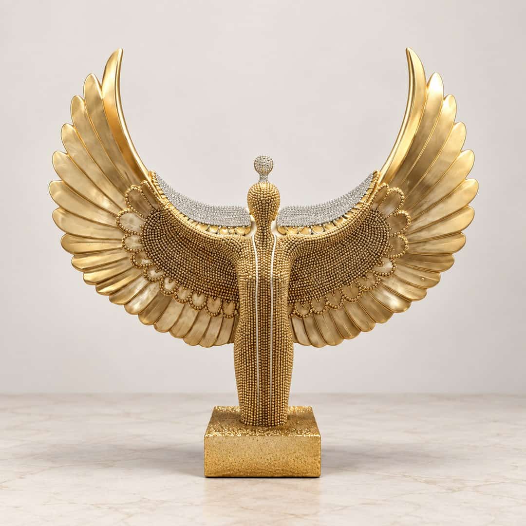 ornate gold-tone phoenix bird sculpture with layered wings and sweeping tail on a display base
