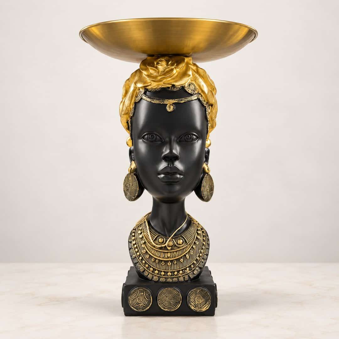 black and gold-tone portrait bust centerpiece topped by a shallow decorative bowl