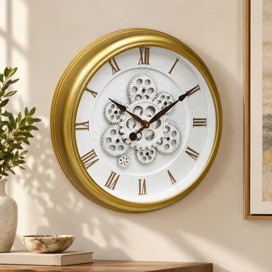 gold-tone round wall clock with white dial, Roman numerals, and silver gearwork