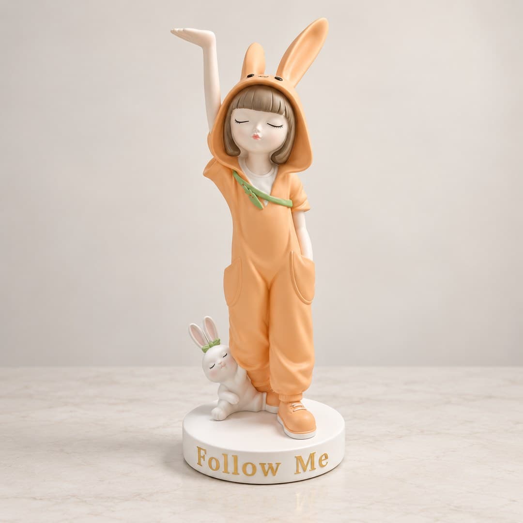 bunny-hood girl figurine in a peach outfit standing beside a small rabbit companion
